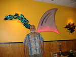 And a final picture with Eric, Fins' friendly and welcoming owner standing by the softly glowing Fin in the dining room wall. He traded in his ties for Aloha shirts. Mahalo, Eric!  