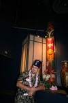 Johnny models with a happy, though painted, Tiki pole.