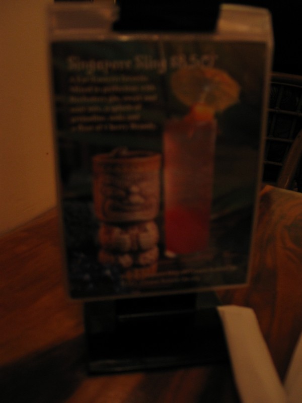 The following are a bunch of blurry pix of the sushi bar drink menu cards. (The ones taken with the flash were hopeless.) No, they don't come in mugs- it's a sad tease of what used to be. Singapore Sling.