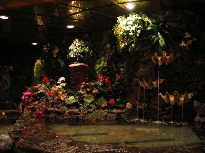 A good glimpse of the former glory. A shell waterfall and Tiki hide near the back of the lobby hall in what was once one of the dining rooms.
