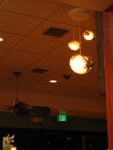 A trifecta of blowfish lamps near the bar area.