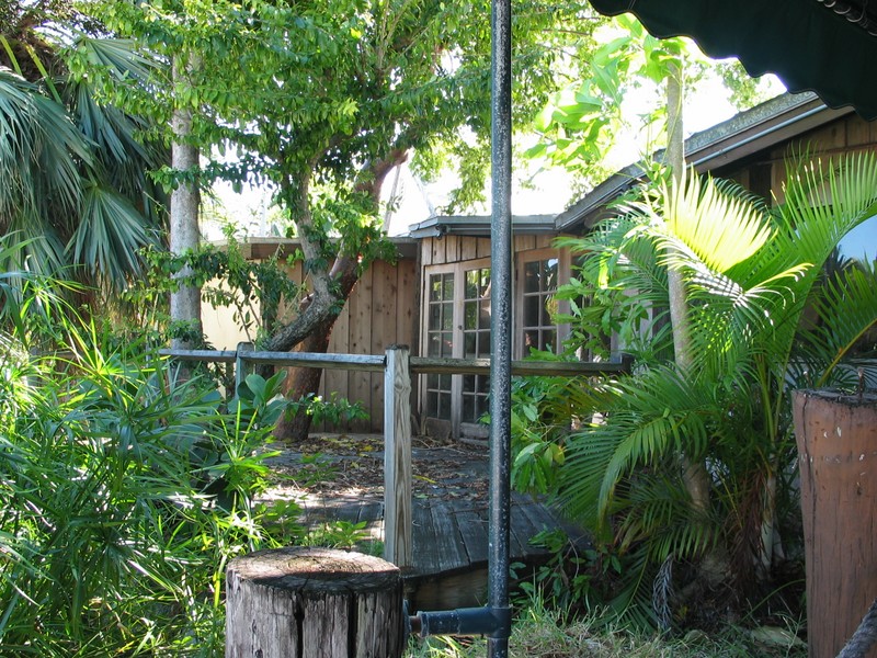 The deck just to the left of the entrance.