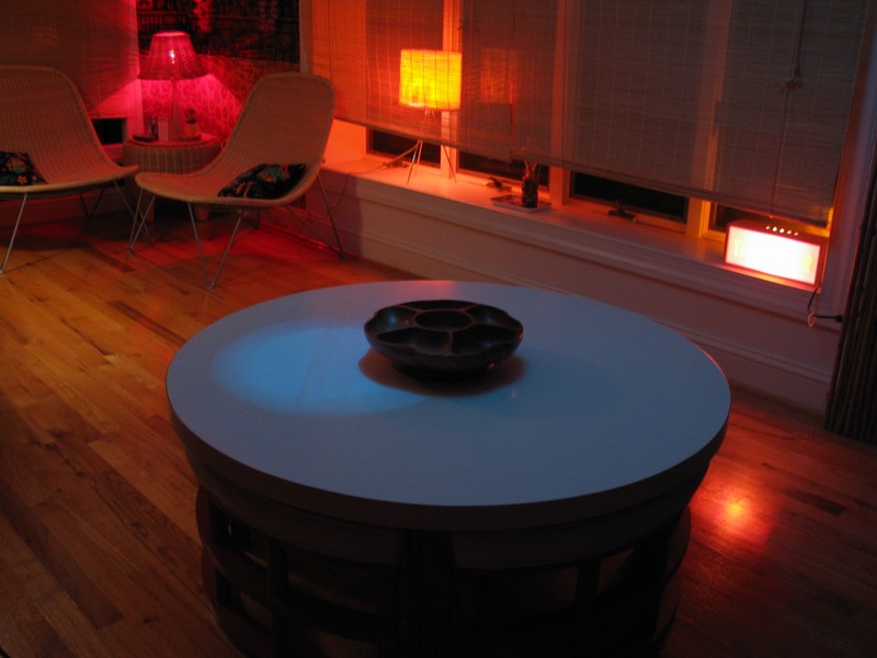 This is a good picture of the table with four wedge shaped stools that slide out from underneath. Also note the bright orange 'flame' motion lamp in the windowsill that I enventually hope to turn into a Volcano... .