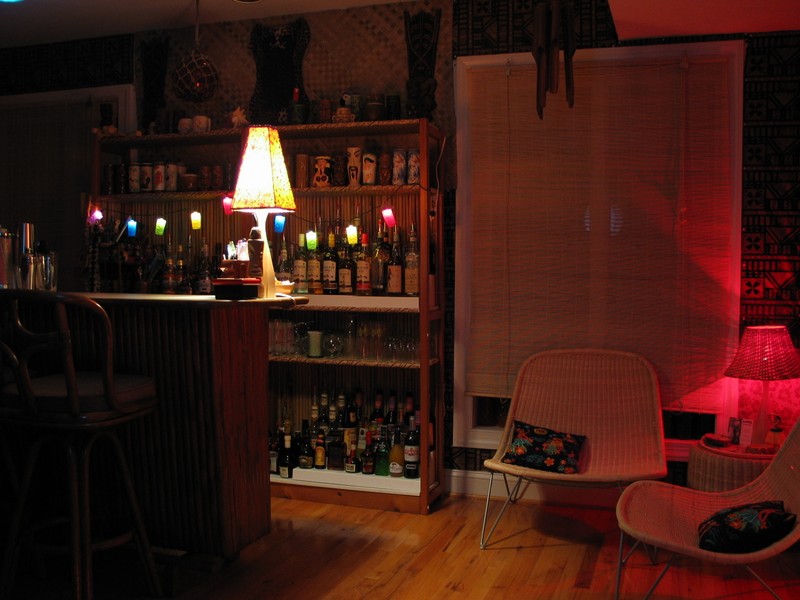 To the right of the bar is a small seating area.