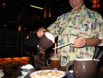 a Kona Coffee Grog. Unfortunately, the Mai Kai was in between supplies of the original mugs this drink comes in, but here at least you have a pretty good series of the steps involved in their potent after dinner spectacle. 