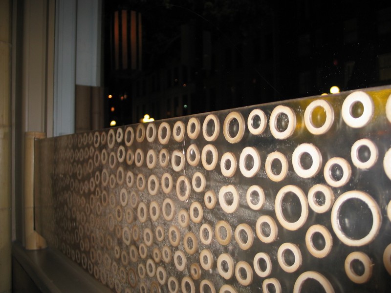at the tables along the side wall, these bamboo ringed dividers help block out the external street view.