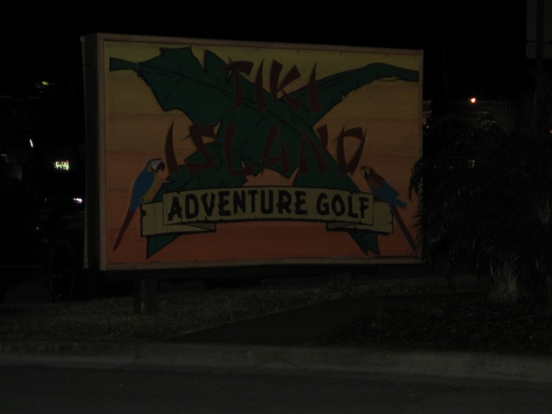 a very dark picture of 'Tiki Island Adventure Golf'.