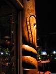 A Tiki guards the oven on the corner where the glass pannels meet.