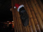This is one of the Tikis on the massive bamboo disguised support beams that are at an angle. Yes, it's Yuletide, and Vic's is decked out with lights and cheer.