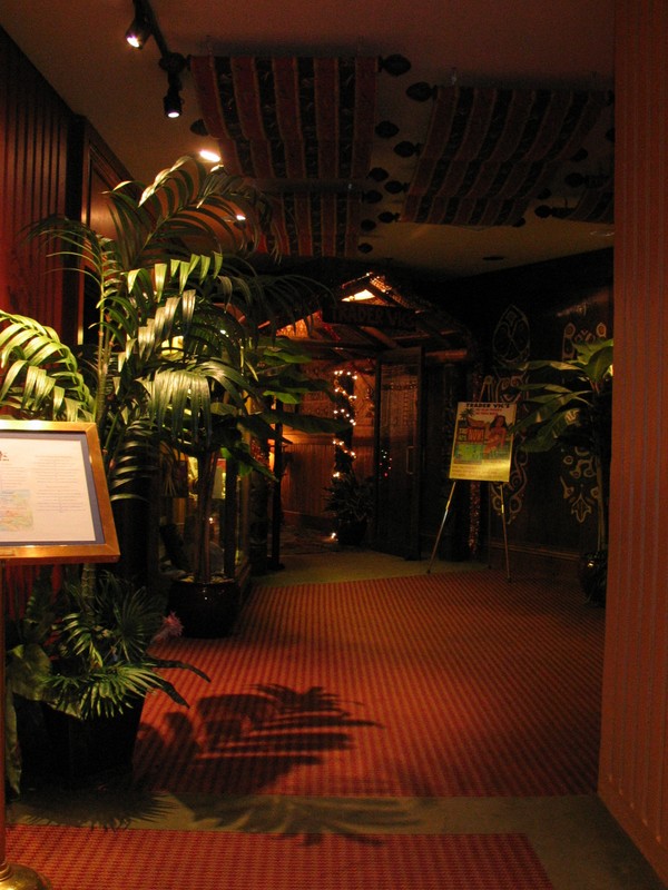 Finally, the entry hallway. We stop to look at books and mugs in a glass case, then head in. 