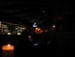 A darker view from "our" booth. You can see the bar in the foreground, and the floats of the back room beyond. The candle in the foreground is on our table.