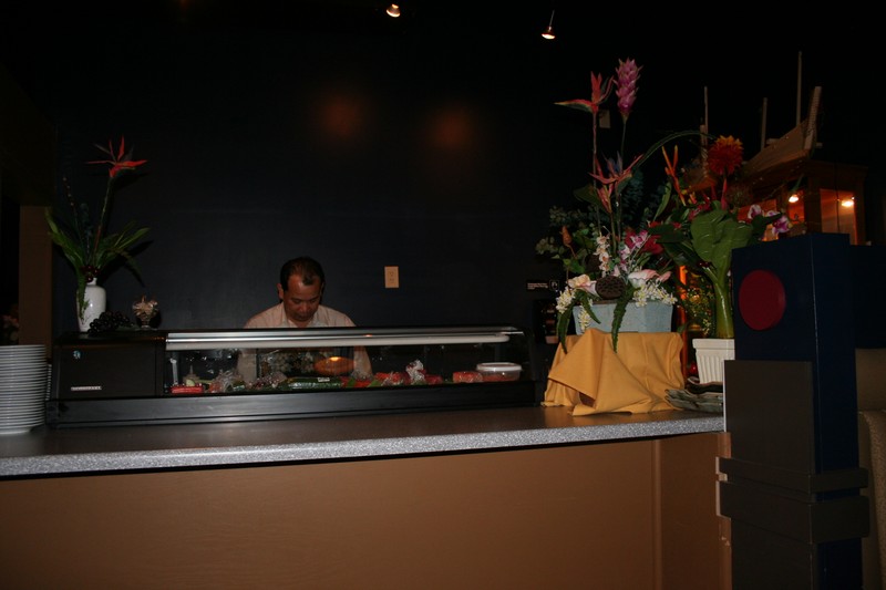 Also near the back is a sushi bar adorned with tropical flowers.