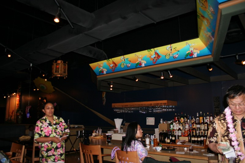 Near the fishtank is the bar area on an upper level overlooking the main dining area.