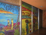 The glass doors of the Outrigger room have been painted in a Tiki mural.