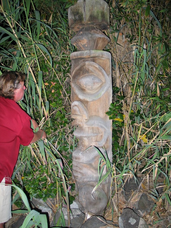 It takes two expert Urban Archeologists to pull back all the bushes around this fellow.