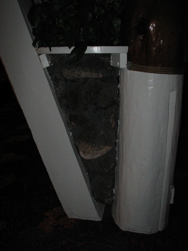 It's hard to see, but the area between the beam and post is filled with Lava rock.
