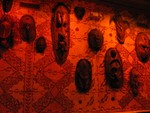Masks along the kitchen wall.