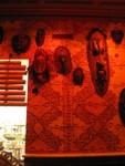 The window into the kitchen is shaded with bamboo.